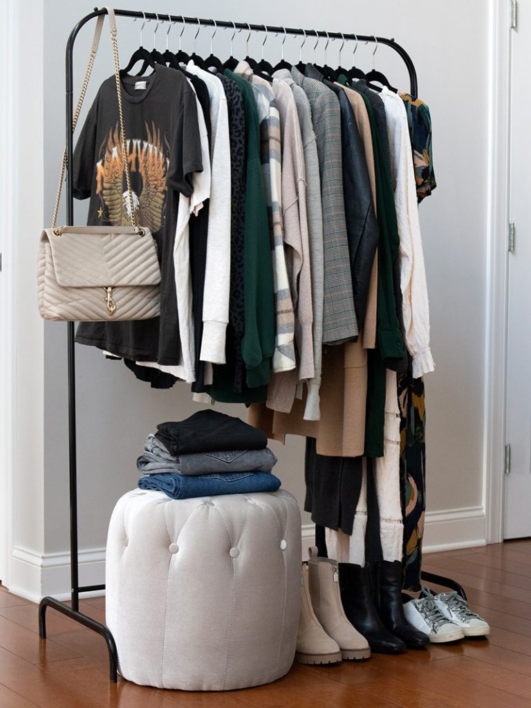 A rack of seasonal clothing for a capsule wardrobe. 