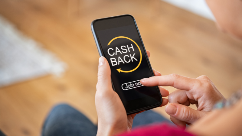 person using cash back app on phone