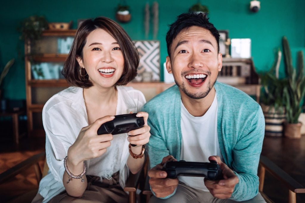 A couple play video games. 