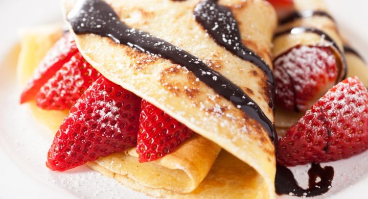 Crepe with chocolate sauce and strawberries